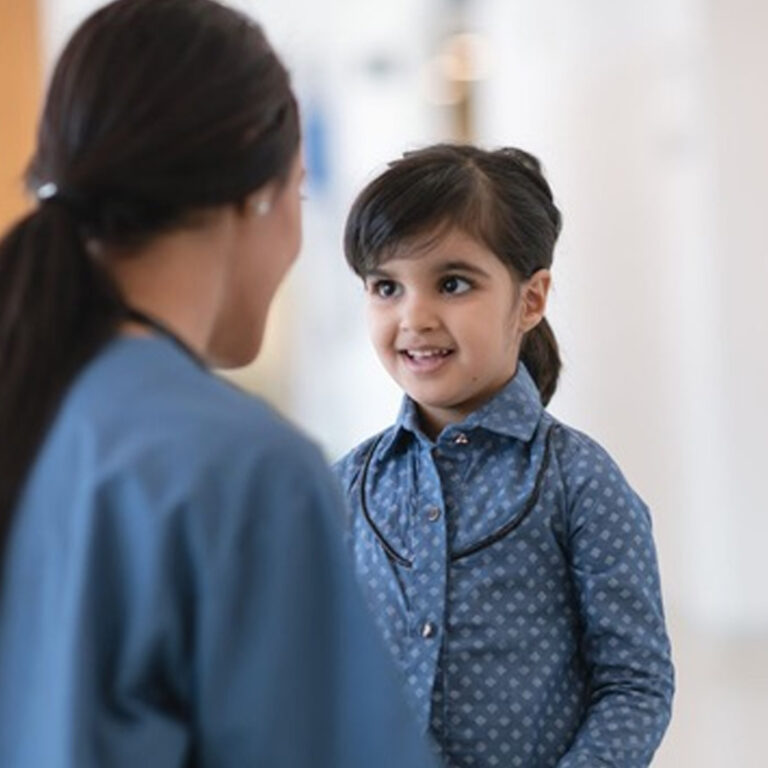 Child receiving proton beam therapy at a specialised cancer treatment centre
